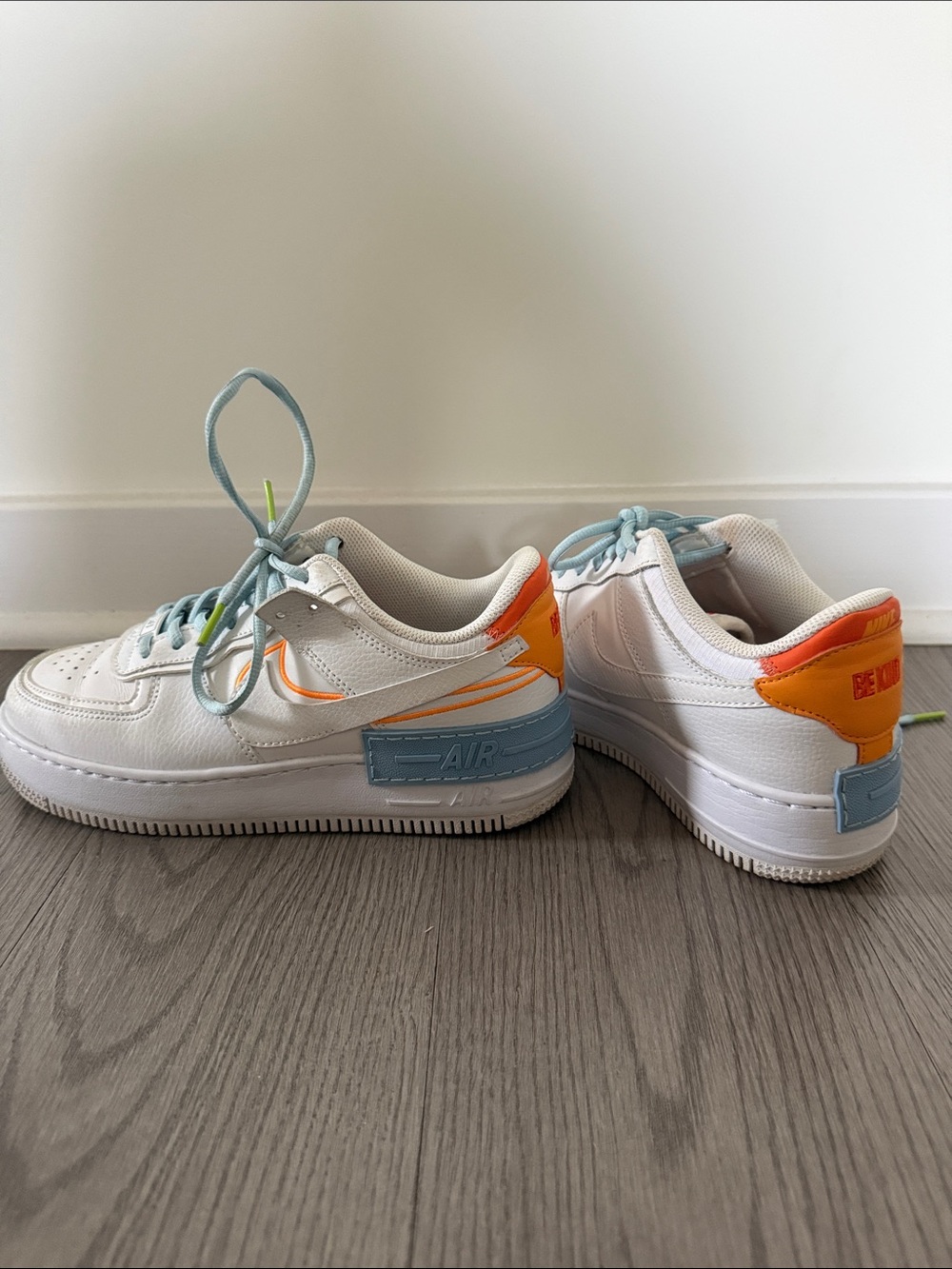 Nike White Low-Top Sneakers with Light Blue & Orange Accents